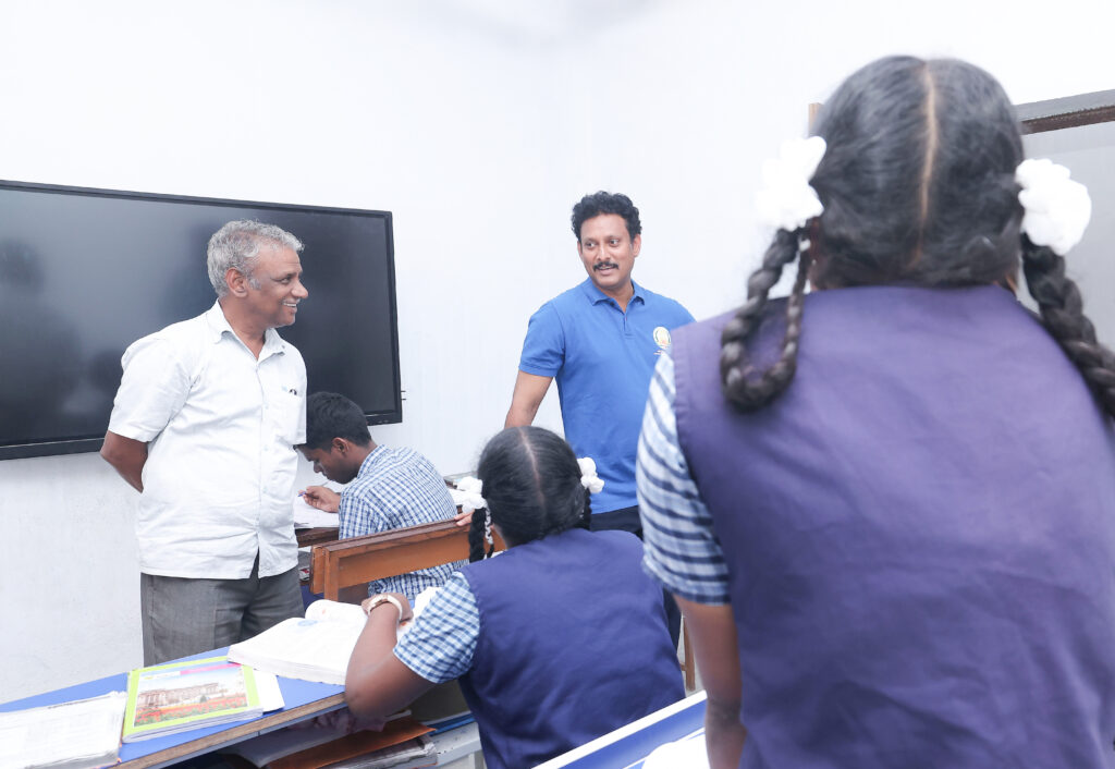 Minister interacting with Students