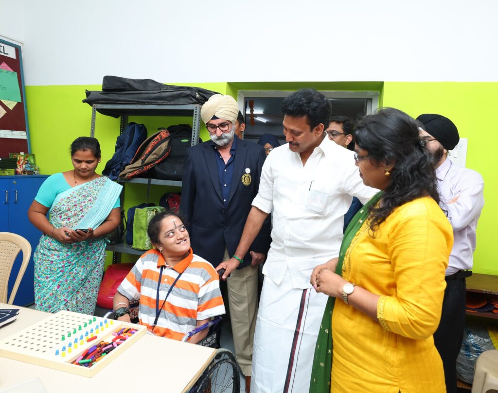 Minister interacting with students with special needs