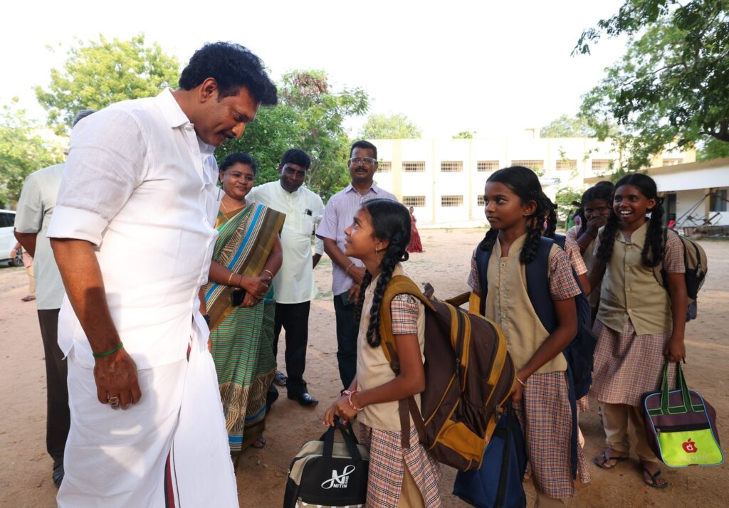 Minister interacting with girls students inside school campus