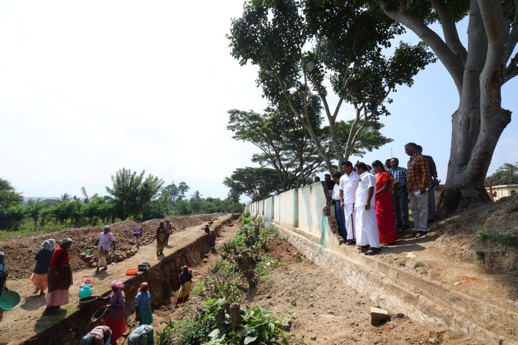 Anbil mahesh inspecting the cleaning work conducting near school campus during 234/77 visit