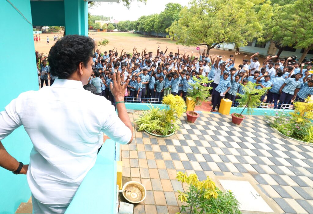 Minister greeting students at a school