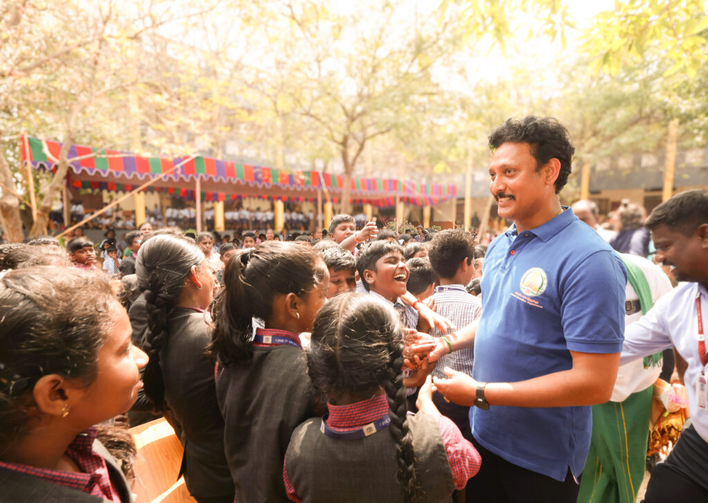 Anbil Mahesh interacting with students