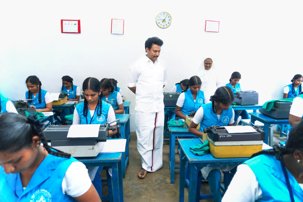 Anbil Mahesh interacting with students