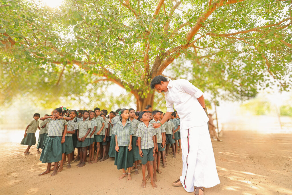 Minister Anbil Mahesh Poyyamozhi with government school kids
