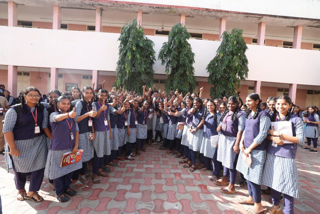 Anbil Mahesh Poyyamozhi with government school students during an examination