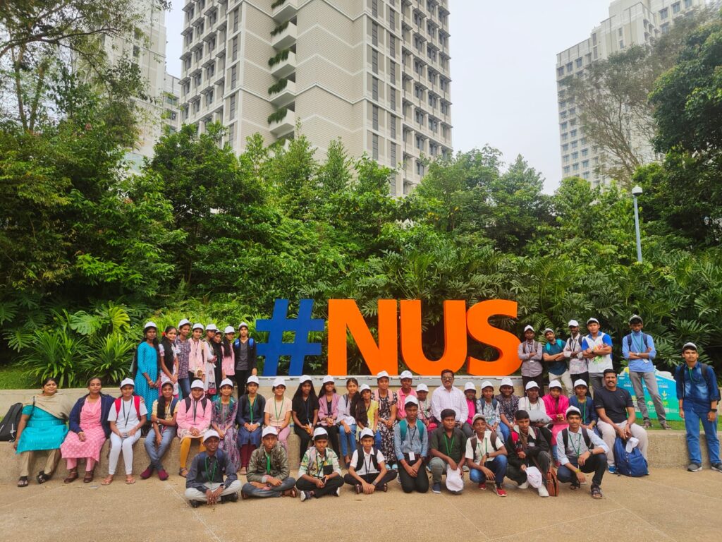Anbil Mahesh Poyyamozhi with students of government schools on a trip to singapore