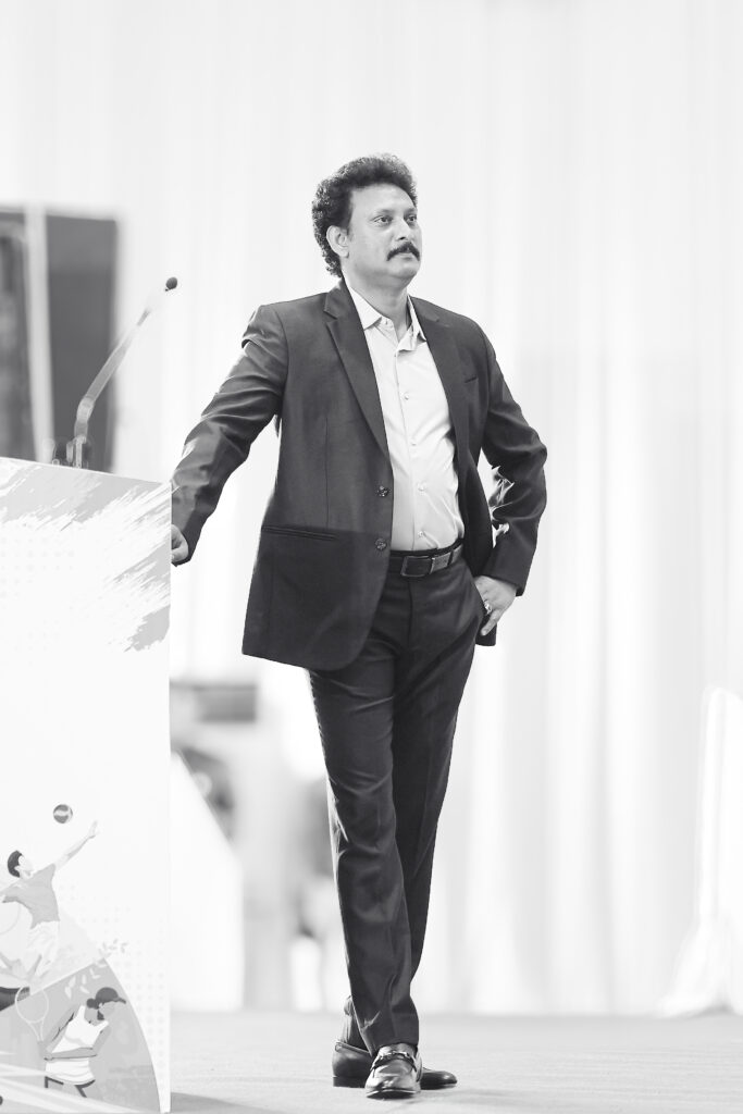 Monochrome image of Minister Anbil Mahesh Poyyamozhi in blazers