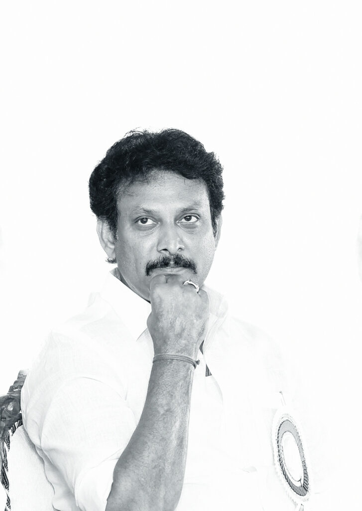 Thoughtful image of Anbil Mahesh in Monochrome
