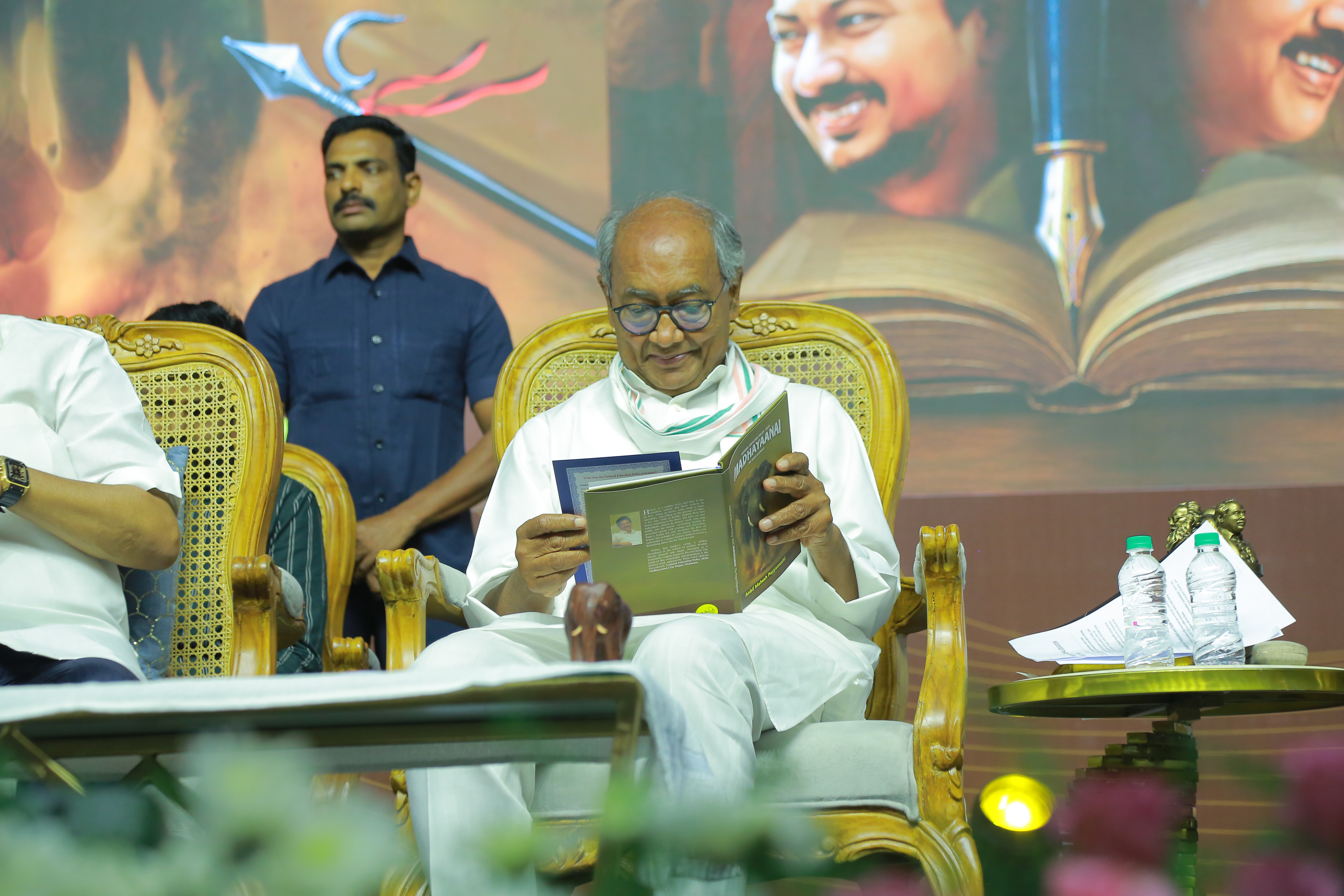 Senior Congress leader Digvijaya Singh engaged in reading "Madhayaanai", a bilingual critique of NEP 2020, authored by Anbil Mahesh Poyyamozhi.