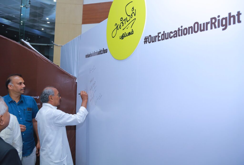 Senior Congress leader Digvijaya Singh signing the education rights pledge wall, showing solidarity with Tamil Nadu’s stance on NEP.