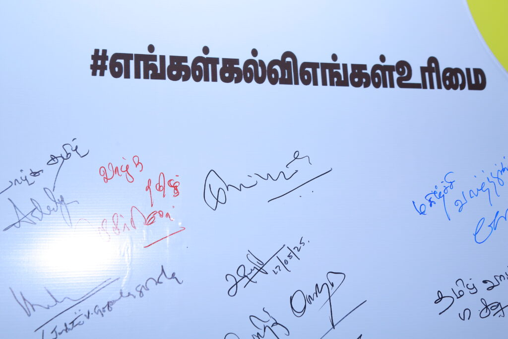 the pledge wall at the "Madhayaanai" event, endorsing the call for educational federalism.