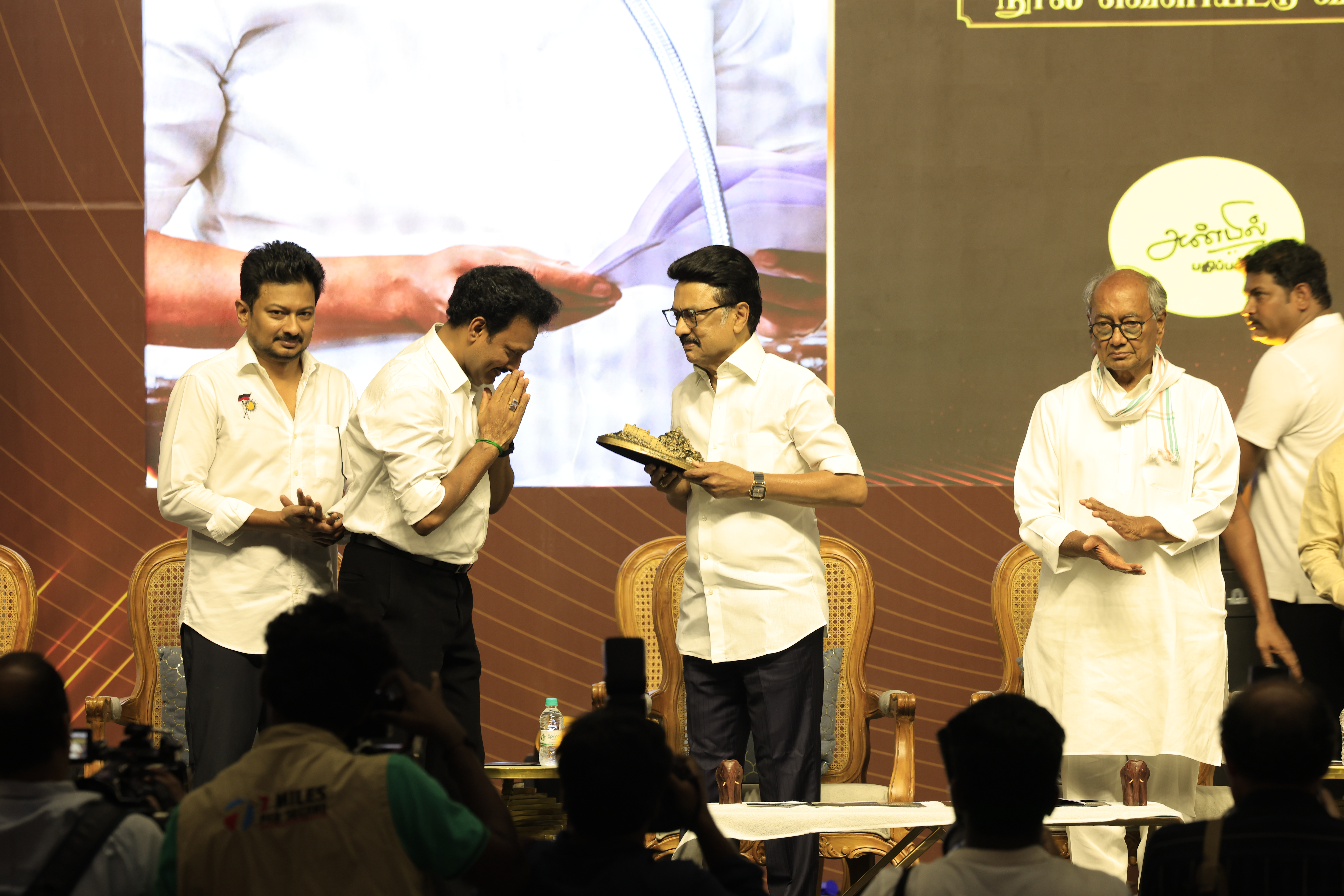 Minister Anbil Mahesh Poyyamozhi respectfully greeting Chief Minister M. K. Stalin during the release of his book "National Education Policy 2020: Madhayaanai".
