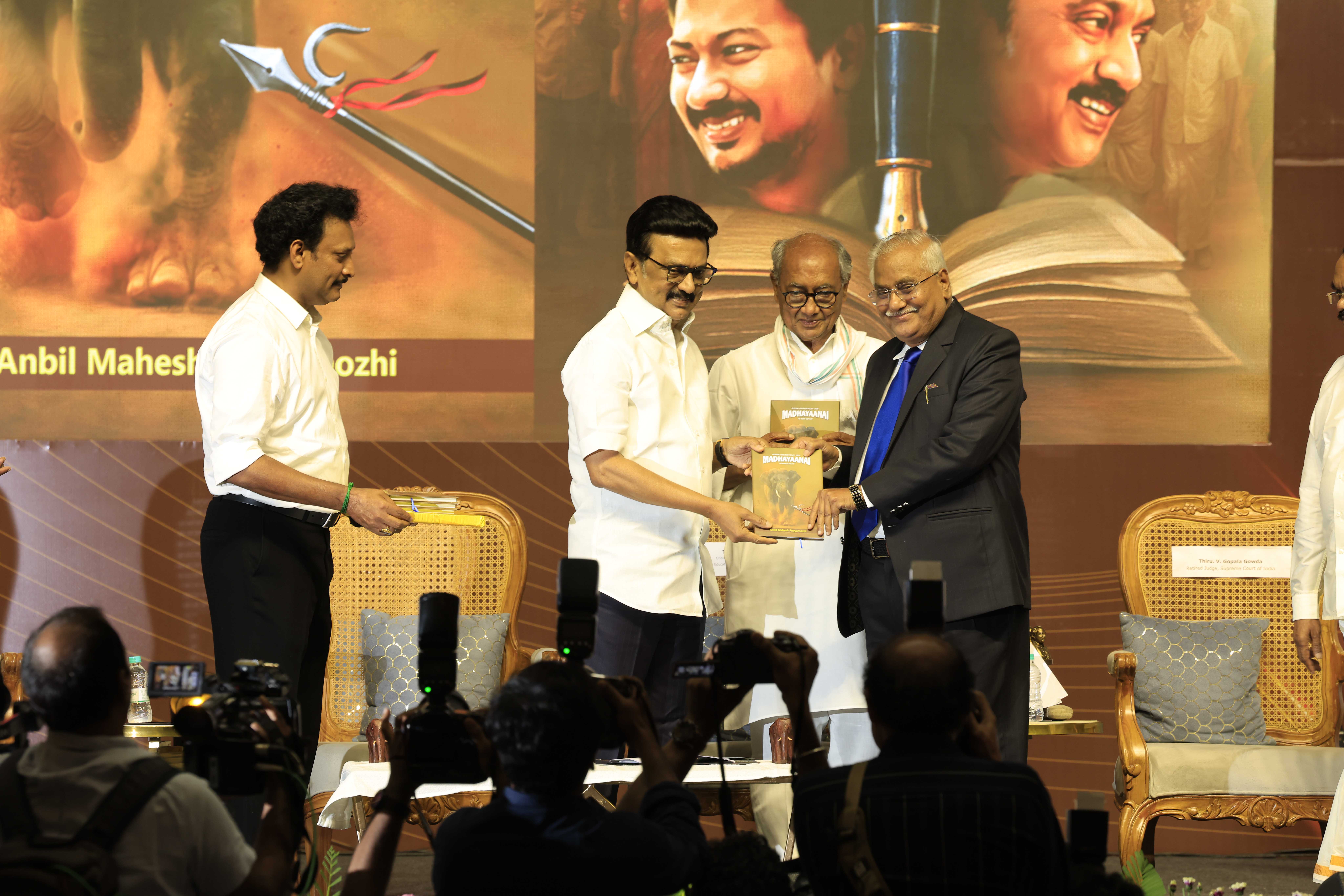 Chief Minister M. K. Stalin presenting the book "Madhayaanai" to Dr. V. Gopala Gowda in the presence of author Anbil Mahesh Poyyamozhi and Digvijaya Singh.