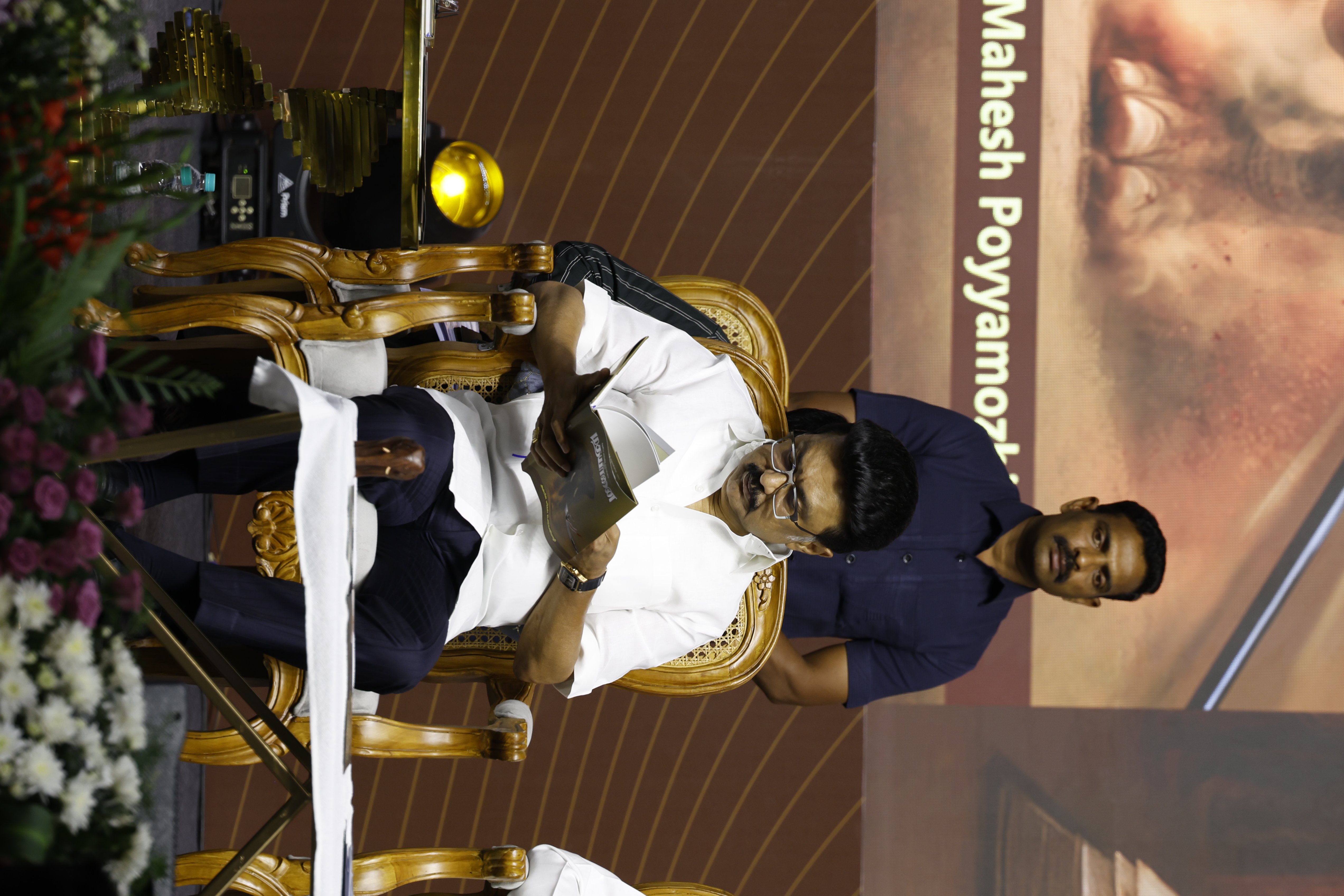 Chief Minister M. K. Stalin intently reads a copy of "Madhayaanai" at the official launch of the book authored by Anbil Mahesh Poyyamozhi, critically analysing NEP 2020.