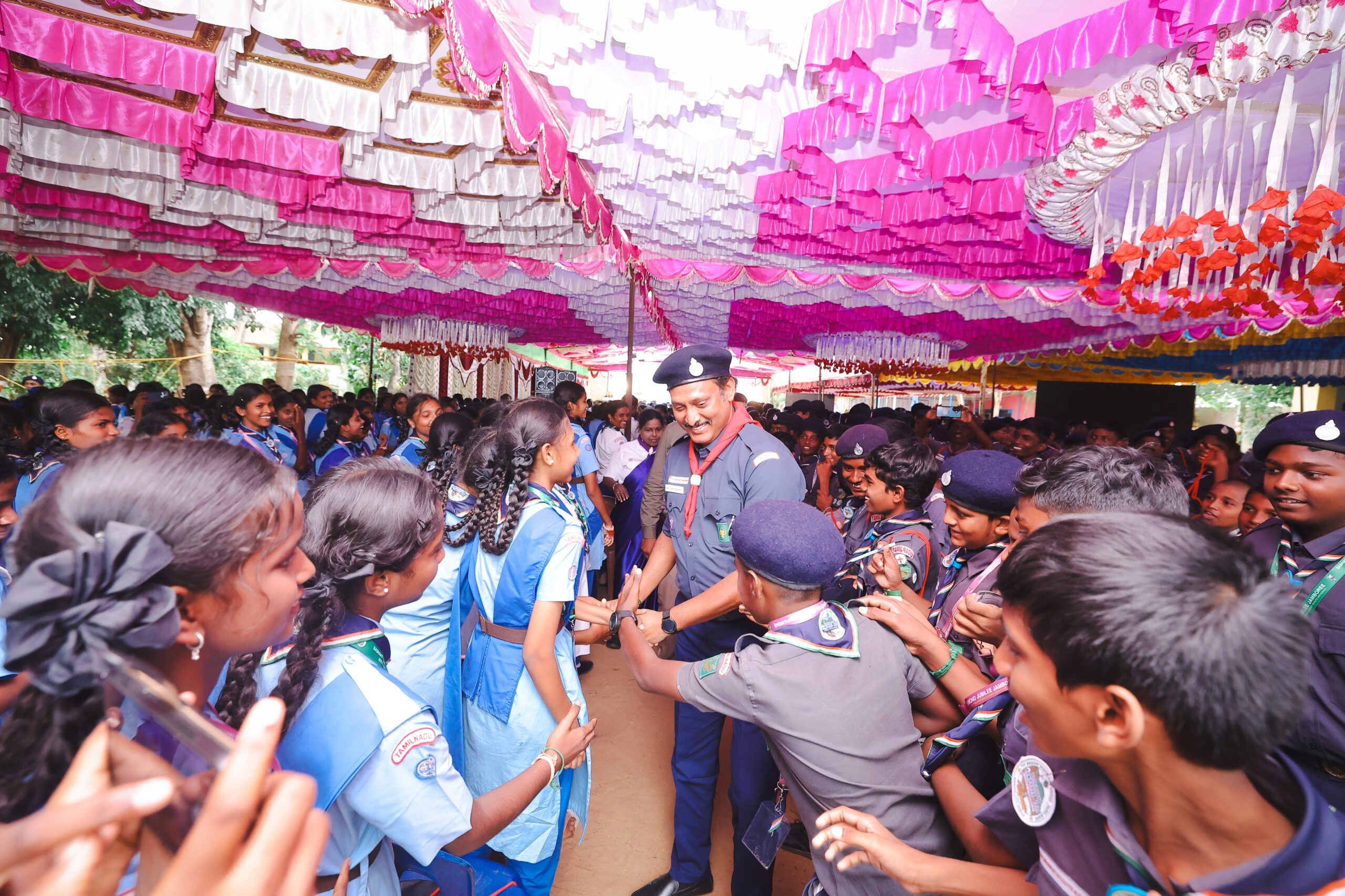 Minister Anbil Mahesh Poyyamozhi, the state president of Bharat Scouts and Guide Tamil Nadu interacting with guides and scouts students