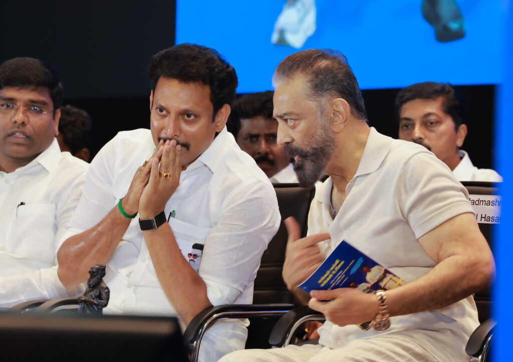 Minister Anbil Mahesh and MP Kamalhassan interacting on the stage