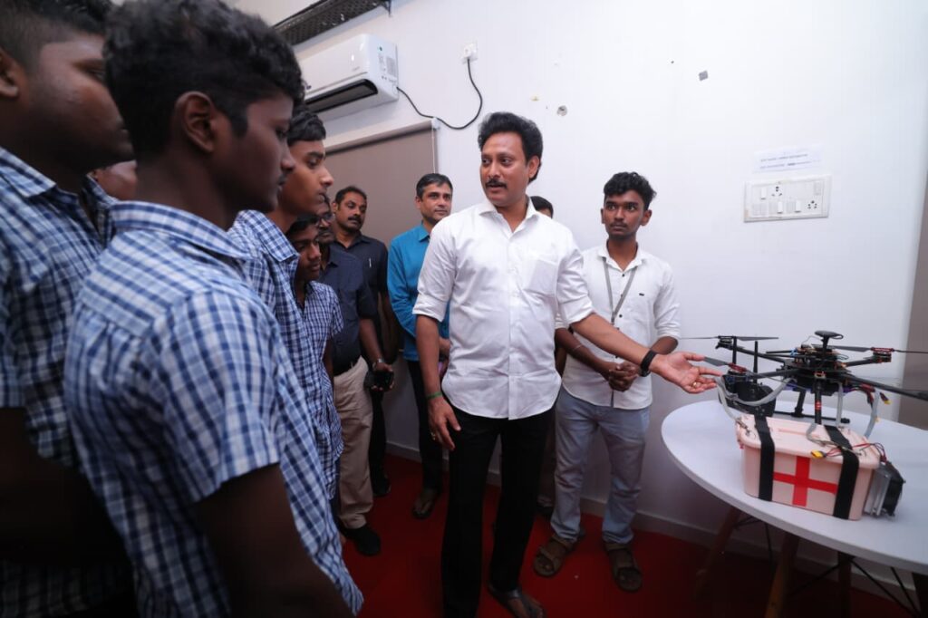 Minister Anbil Mahesh with Government School Students during the college field visit