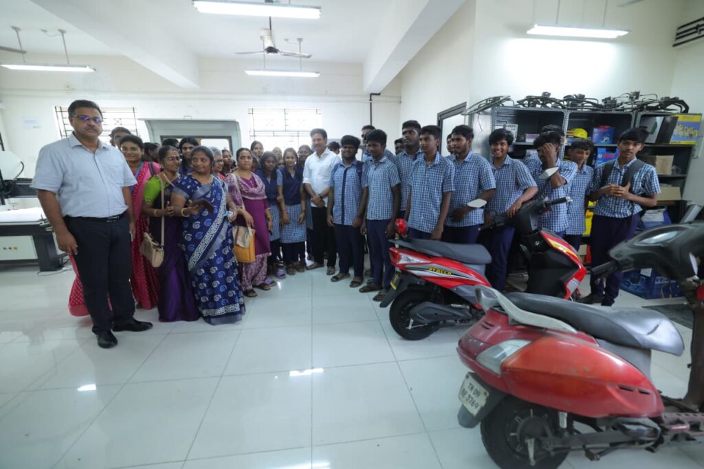 Minister Anbil Mahesh with Government School Students during the college field visit